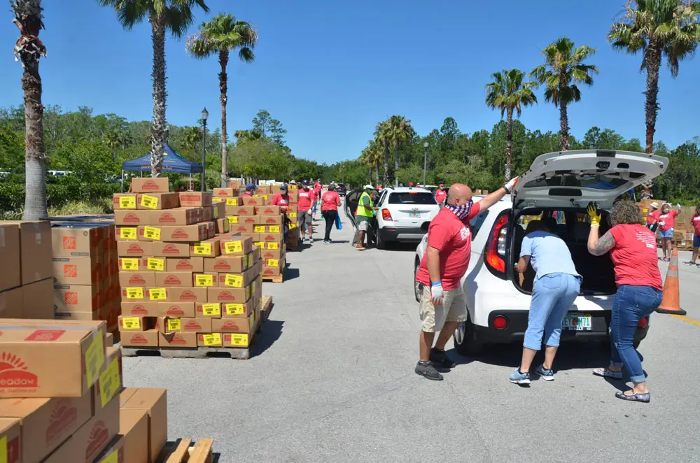 The massive food distribution Palm Coast government organized on May 2, 2020. It would turn out to be the only one organized by a local government, though weekly distributions took place before and have continued to take place since through Grace Community food pantry on Education Way. (© FlaglerLive)