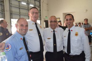 The Forte legacy: Jason Forte, left, a lieutenant with Flagler County Fire Rescue, Mike Beadle, Palm Coast Chief Jerry Forte, and Anthony Forte, a lieutenant with the Flagler Beach Fire Department. (© FlaglerLive)