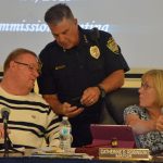 Bunnell Police Chief Tom Foster, who left the city last week, seen here at a previous City Commission meeting, with Commissioner John Rogers and Mayor Catherine Robinson. (© FlaglerLive)