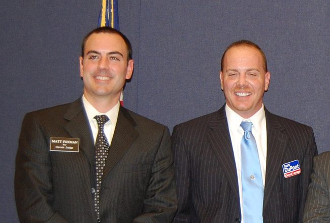 hen-judicial candidates Matthew Foxman, left, and Scott DuPont in an appearance at a Bunnell forum during their first campaign in 2010. Both won. DuPont subsequently ignored Foxman's warnings about acting inappropriately in his second election campaign in 2016, warnings the Judicial Qualifications Commission cited among its evidence to recommend DuPont's removal, and warnings DuPont ignored. (© FlaglerLive)