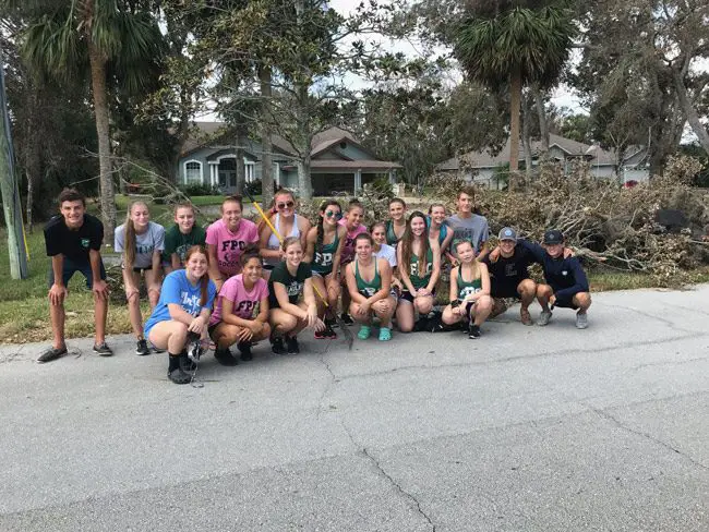Give 'em a cheer: the Flagler Palm Coast High School cheer squad, after helping out in Flagler Beach Sunday morning. (Twitter)