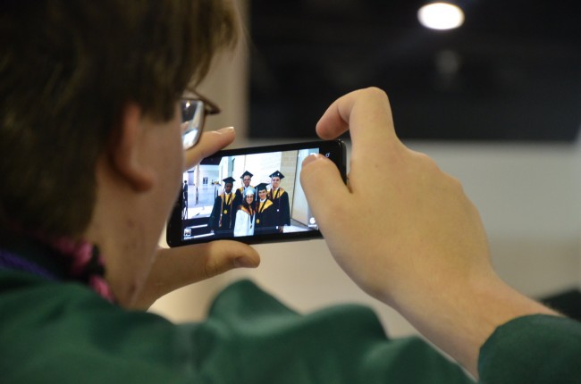 FPC students furiously shot their way through last photo ops before their graduation ceremony at the Ocean Center in Daytona Beach Thursday evening. Click on the image for larger view. (© FlaglerLive)