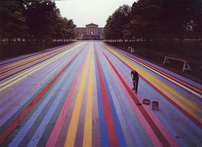 From WikiArt: Soya alkyd paint on asphalt, in front of the Philadelphia Museum of Art. 414 feet long, it was the world's largest artwork at the time. It was featured in the June 16, 1972 issue of Life Magazine. Destroyed in the meantime.