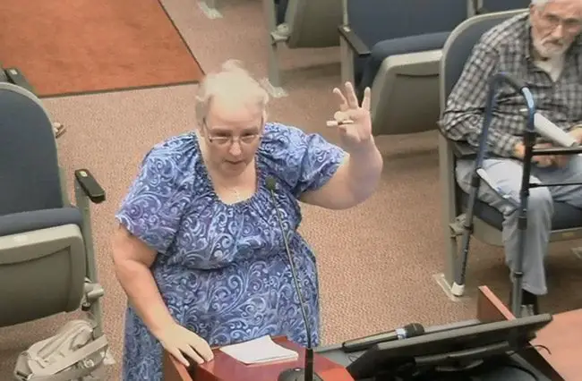 Patricia Freytag holds up an object to show Flagler County Commissioner what a medical marijuana product looks like. 