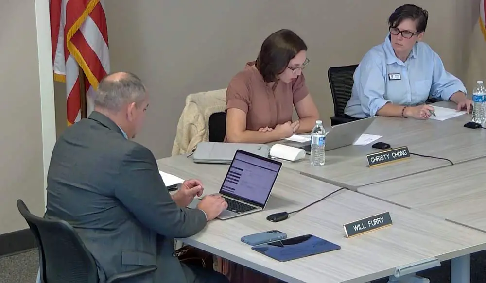 School Board members Will Furry, Christy Chong and Sally Hunt have been on the board for less than a year. Their grasp of sunshine is tenuous. (© FlaglerLive via Flagler Schools TV)