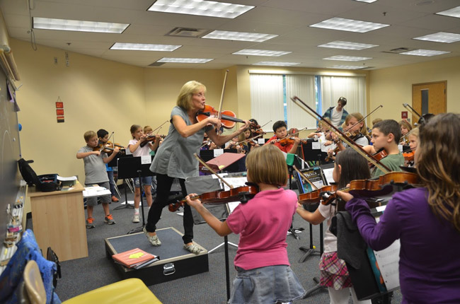 Flagler Youth Orchestra Artistic Director Sue Cryan during rehearsals last week for tonight's concert at the Flagler Auditorium, which will feature all the ensembles and all 375-some musicians of the Youth Orchestra. See details below. (© FlaglerLive)