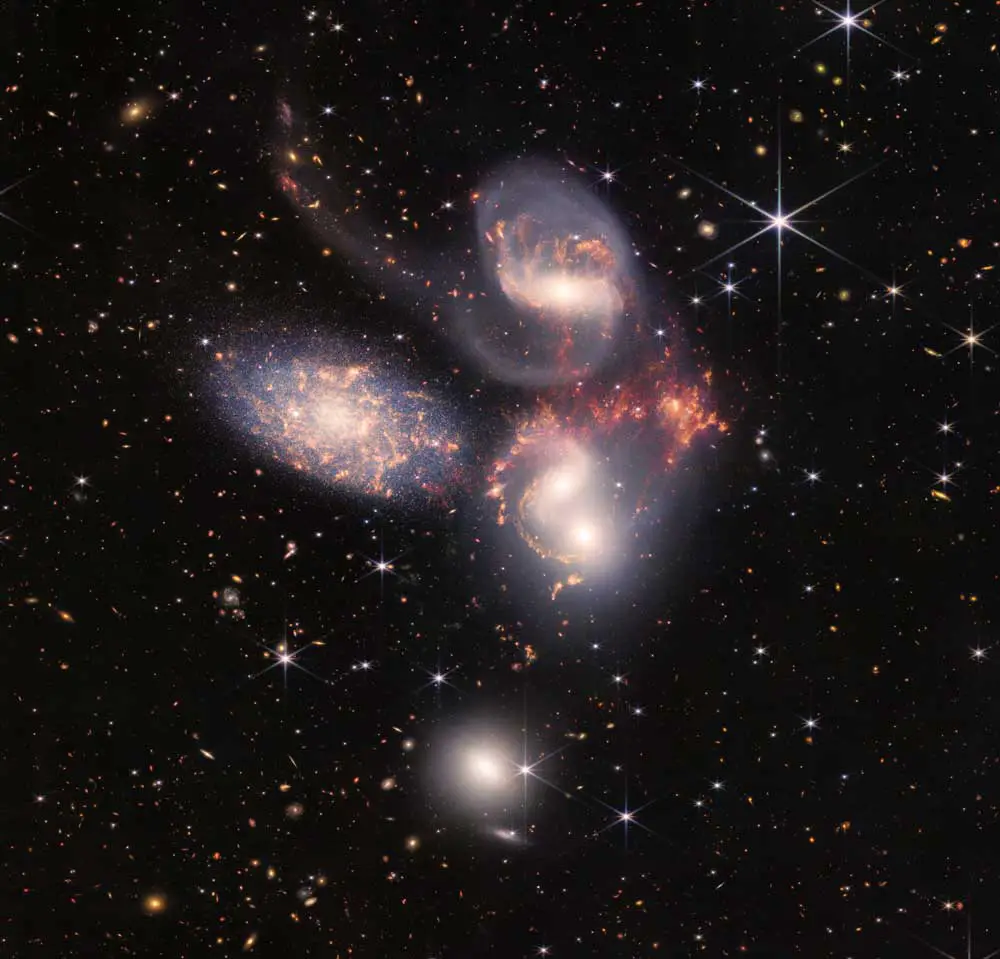 This cluster of galaxies, called Stephan’s Quintet, is a composite image produced from two cameras aboard the James Webb Space Telescope. (NASA/STScI)