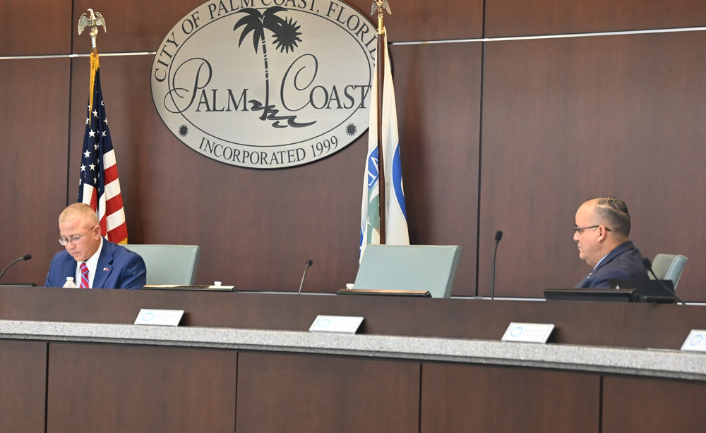 Palm Coast City Council member Charles Gambaro, right (seen here at a previous council meeting) called for an investigation of Mayor Norris over an allegation that he violated the city charter by demanding the resignation of top staffers. (© FlaglerLive)