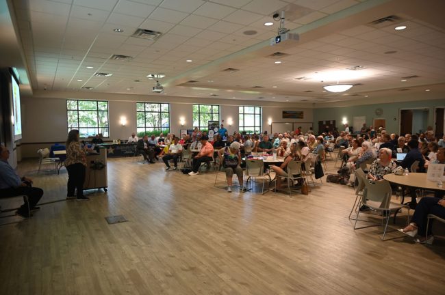 Flagler Volunteer Services' Suzie Gamblain spoke to a capacity crowd. (© FlaglerLive)