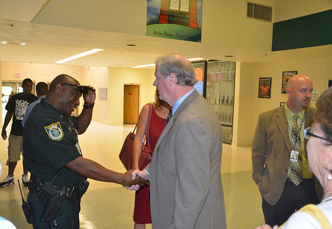 Superintendent Jacob Oliva--still principal at FPC at the time--is to the right, and Superintendent Janet Valentine is looking on further to the right. (© FlaglerLive)