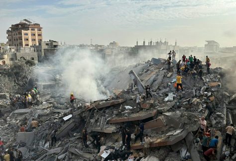 Palestinians look for survivors after a Israeli strike in Gaza on Oct. 31, 2023.