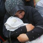 A mother cries for her 4-year-old daughter, who lost her life due to malnutrition and lack of treatment due to the war on Gaza. (Wikimedia Commons)