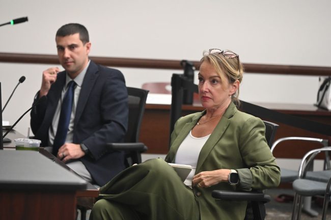 Georgette Dumont, with City Attorney Marcus Duffy. (© FlaglerLive)