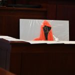 Ghostly evidence: the hoodie Deon Jenkins was wearing the morning he was shot and killed, as placed, for the duration of the trial, just behind the clerk, in full and constant view of the jury. Today, during closing arguments, prosecutors placed the hoodie in front of Marcus Chamblin. (© FlaglerLive)