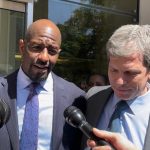 Former Democratic nominee Andrew Gillum (left) and attorney David Markus spoke after a jury acquitted Gillum on one charge and couldn't reach a verdict on other charges. (Dara Kam)