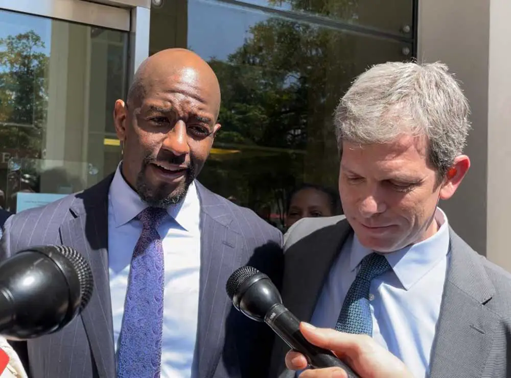 Former Democratic nominee Andrew Gillum (left) and attorney David Markus spoke after a jury acquitted Gillum on one charge and couldn't reach a verdict on other charges. (Dara Kam)