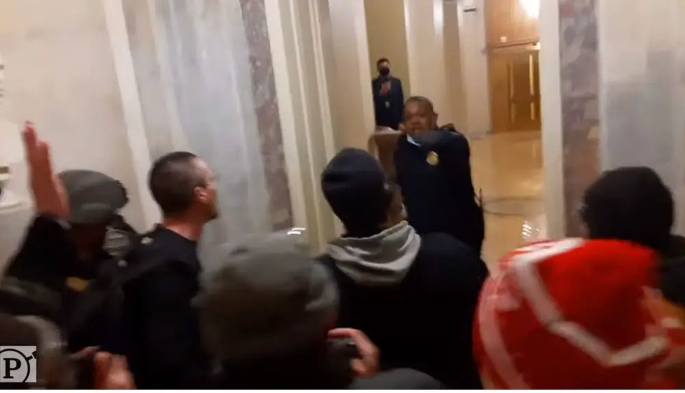 A still from a video obtained by ProPublica showing a mob confronting Capitol Police Officer Eugene Goodman on Jan. 6. (Via ProPublica video/Parler)