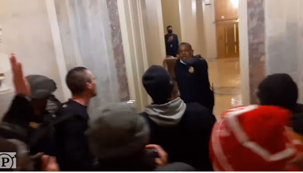 A still from a video obtained by ProPublica showing a mob confronting Capitol Police Officer Eugene Goodman on Jan. 6. (Via ProPublica video/Parler)