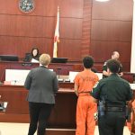 Sean Junior Goska in the orange Volusia County Department of Corrections garb, as Circuit Judge Dawn Nichols read the sentence. (© FlaglerLive)