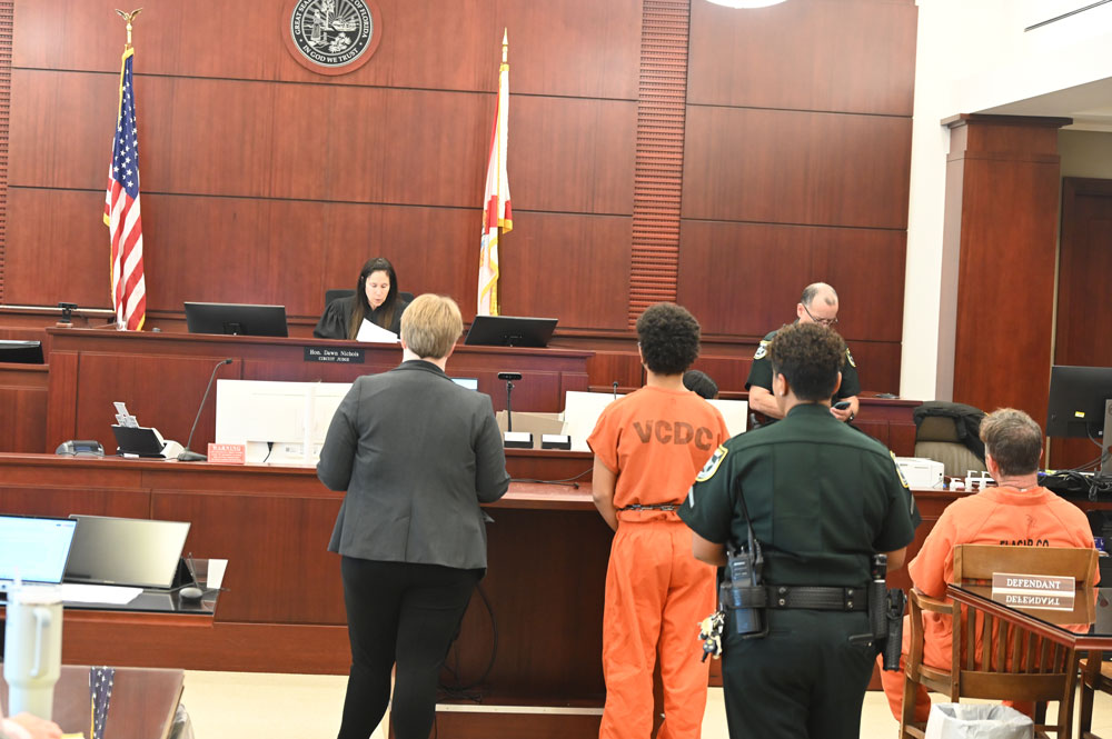 Sean Junior Goska in the orange Volusia County Department of Corrections garb, as Circuit Judge Dawn Nichols read the sentence. (© FlaglerLive)