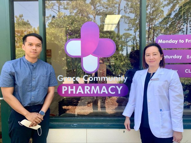 Gilroy Benet, left, got his degree at Boston University and returned home to work in the family business his mother and Pharmacist Grace Benet, left, opened last year. (© FlaglerLive)