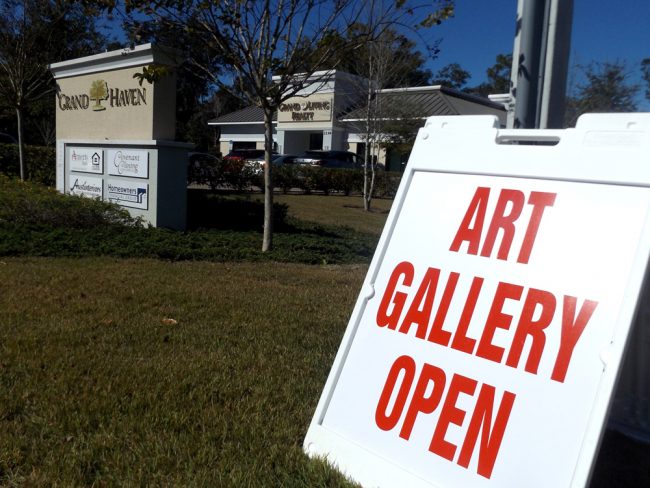    The office building of Grand Living Realty on Colbert Lane houses Grand Gallery, which presents exhibitions by area artists. (© FlaglerLive)