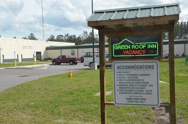 flagler jail green roof inn sign