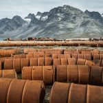 Rusting fuel drums and vehicles remain at an abandoned U.S. World War II base in Greenland.