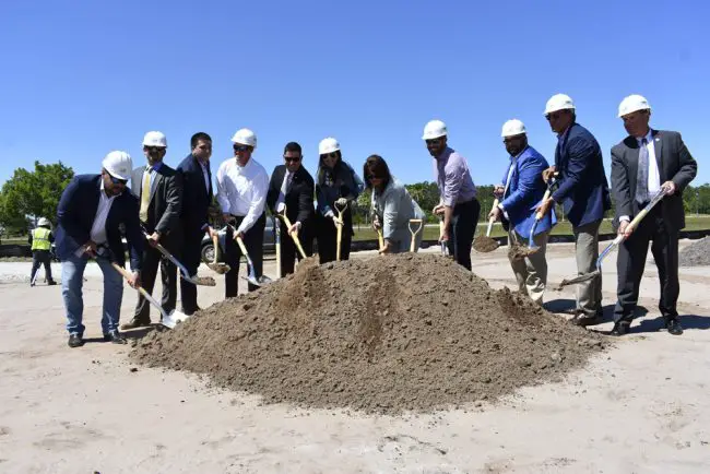 Palm Coast issued the above photograph of city officials and developers breaking ground at the Palms apartment complex last week. 