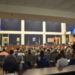 The good days: the school board's last in-person meeting, last February, which drew a capacity crowd. It'll be much different when the school board starts meeting again in person next month. The county commission holds its meetings in the same space. (© FlaglerLive)