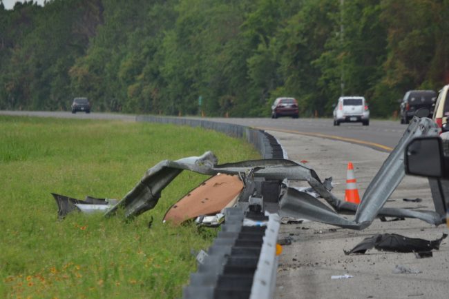 The Honda Civic crashed through the guardrail. Click on the image for larger view. (© FlaglerLive)