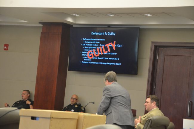  Michael Bowling, to the right,  during closing arguments, when the prosecution asked the jury to find him guilty. It did. (© FlaglerLive)