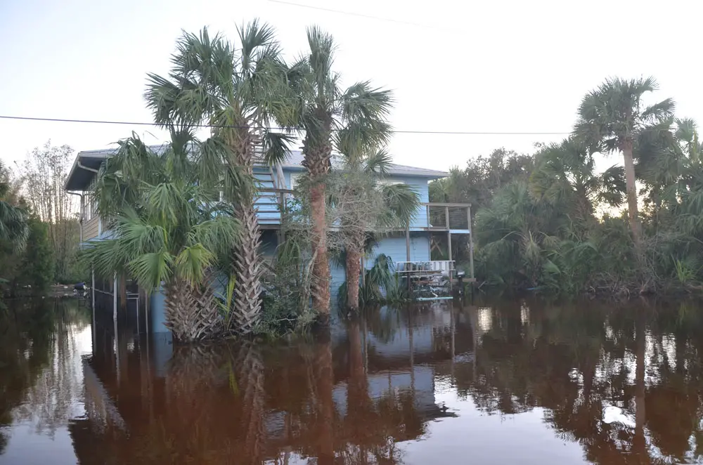 A flooded property in the Hammock in 2016, in the aftermath of Hurricane Matthew, whose effects were limited to tropical storm conditions onshore. (© FlaglerLive)