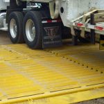 use a grid system to prevent truck tires from tracking dirt beyond its property.