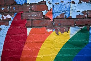 A painted rainbow peels off a wall in Laramie, Wyo., where nearly 26 years ago Matthew Shepard was killed.