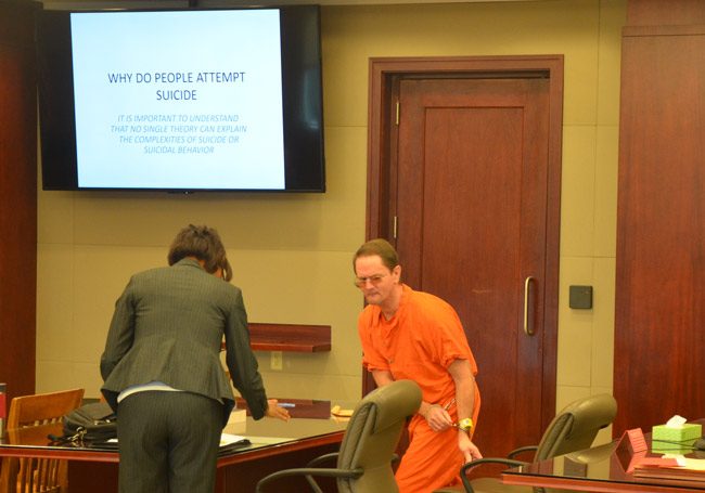 Bruce Haughton, in shackles, arriving for his court hearing today. (© FlaglerLive)