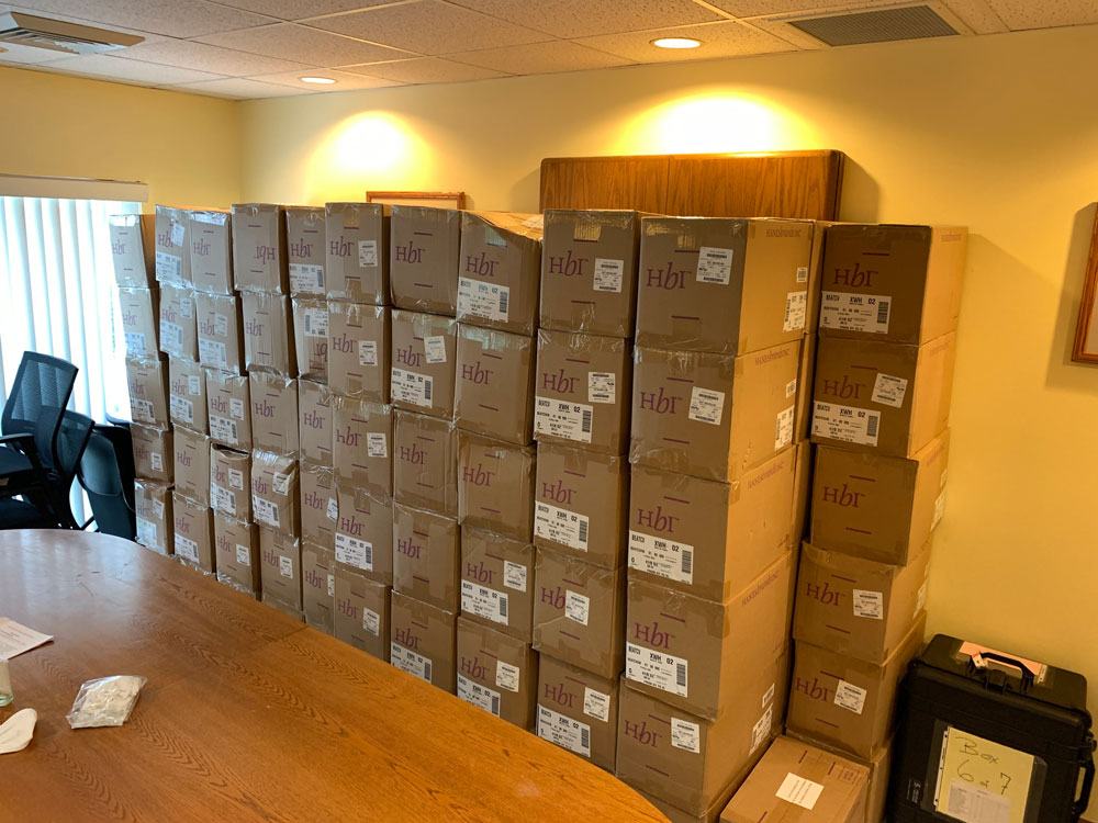 The 5,000 masks stored at the Flagler County Health Department before the department started distributing them free at Palm Coast Fire Station 25 off Belle Terre Parkway. Palm Coast, Bunnell and Flagler Beach all enacted mask mandates last week. (© FlaglerLive)