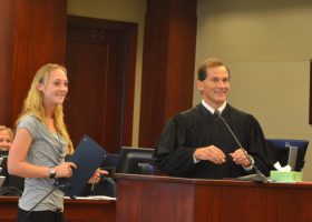 Heartbreaks over, Lacie Marie Stowel today was one of three drug court graduates, accepting her certificate and dropped charges from Judge Dennis Craig. (© FlaglerLive)