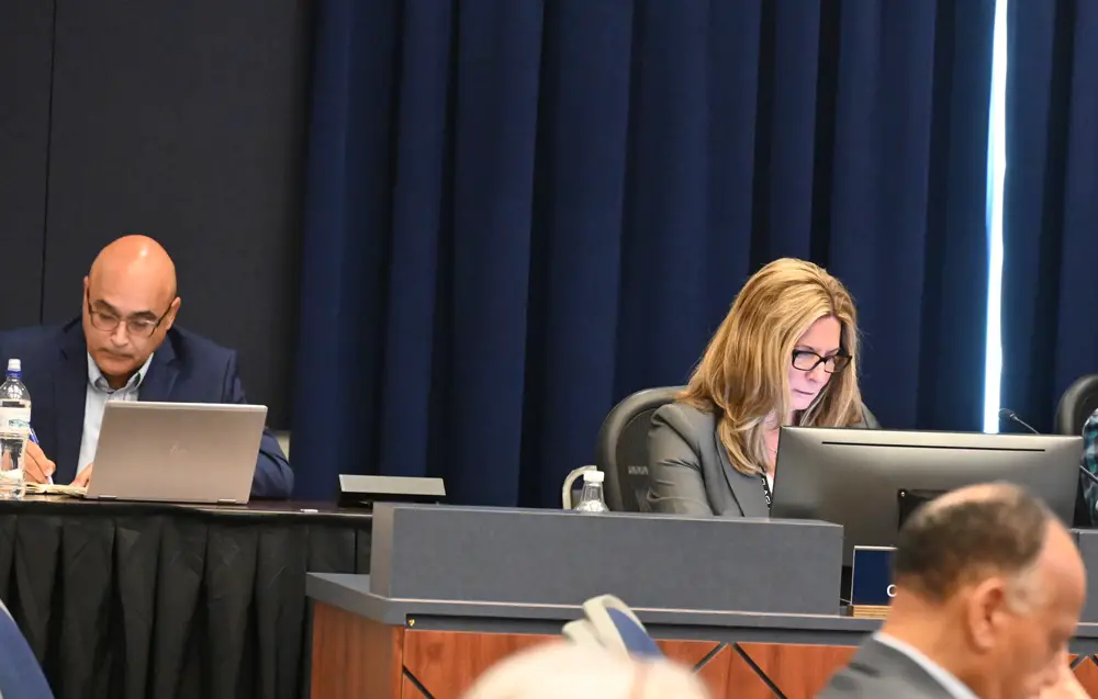County Administrator Heidi Petito, right, completed her second full year as administrator last October. Deputy Administrator Jorge Salinas is to the left. (© FlaglerLive)