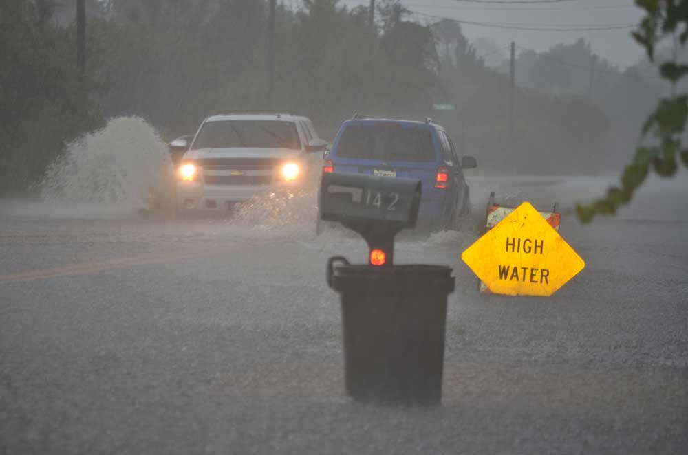 Despite serious rain events, like the one above, in previous years, Palm Coast's stormwater system has kept homes dry. But at a rising price. (© FlaglerLive)