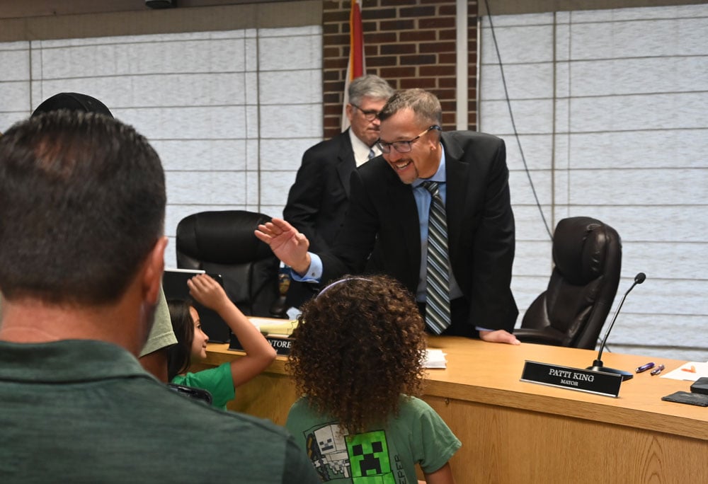 R.J. Santore high-fiving his daughter after his swearing-in last Thursday. (© FlaglerLive)