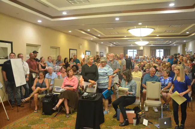 A crowd far above capacity filled the conference room at the Hilton Garden Inn this evening. (c FlaglerLive)
