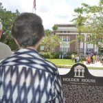 The Flagler County Historical Society has long had its eyes on the old, historic courthouse across the street from Holden House, the museum and public face of the society. The late Sisco Deen, left, who died less than a year ago, was looking at the courthouse scene in August 2015, when the facility reopened as a Christian school. The school is now moving and ceding the way to the school district. (© FlaglerLive)