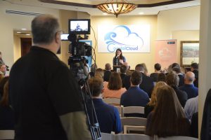 Palm Coast Mayor Milissa Holland, a director of development at Coastal Cloud, emceed the event and blurred her two roles, at one point urging her listeners to partner with the company. (© FlaglerLive)