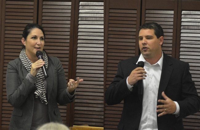 There are plenty of reasons to argue who might make the best candidate. The majority or minority status of each candidate's party is not one of them. Above, Democrat Milissa Holland and Republican Travis Hutson, candidates for the Florida House seat that includes all of Flagler County, last week at the Flagler Women's Club. (© FlaglerLive)