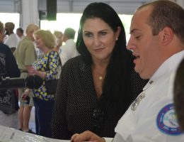 Palm Coast Mayor Milissa Holland and the Fire Department's Patrick Juliano going over ceremony timing before the event. (© FlaglerLive)