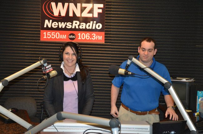 Milissa Holland and WNZF engineer Marc Gilliland when Holland was taping her radio show in 2012. The paiur is at work again preparing 'Discover Palm Coast,' Holland's new weekly radio show, starting in March. (© FlaglerLive) 