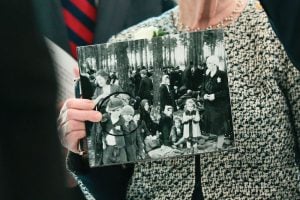 Irene Fogel Weiss holds a photograph of her mother and brothers, who were killed during the Holocaust, during a ceremony at the U.S. Capitol on April 14, 2026, in Washington.