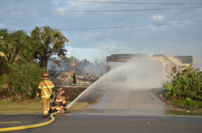 Only a shell was left of the house after an hour. Click on the image for larger view. (© FlaglerLive)