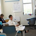 Sally Hunt, center, had not developed a rapport with Superintendent Cathy Mittlestadt, left, and was leaning toward not renewing her contract. (© FlaglerLive)